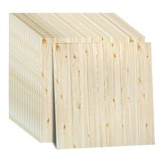 three pieces of plywood are stacked on top of each other, one is white and the other is light brown