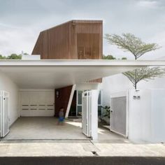 an open garage with doors on both sides and a person walking in the doorway at the end