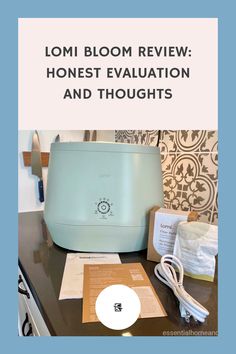 a blue toaster sitting on top of a counter next to a box with the words lomi bloom review honest evaluation and thoughts