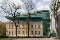 a large building that is next to some trees