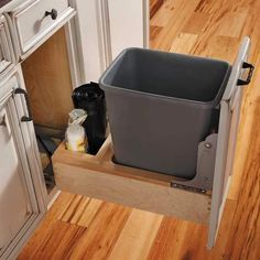 a trash can sitting on top of a wooden shelf