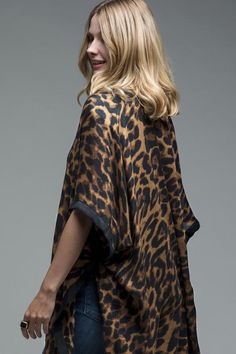 The beautiful leopard printed kimono features a black border with side slits. It is a versatile piece that can be worn on a casual day out or paired with a cute brown dress and leopard high heels. 100% polyester One size fits all -- the kimono is a perfect fit for a curvy woman Cute Brown Dress, Leopard High Heels, Leopard Kimono, Printed Kimono, Cute Black Dress, Leopard Cardigan, Kimono Duster, Trendy Dress Outfits, Cotton Kimono