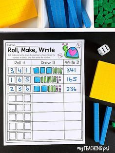 the roll, make, write activity is displayed next to legos and pencils