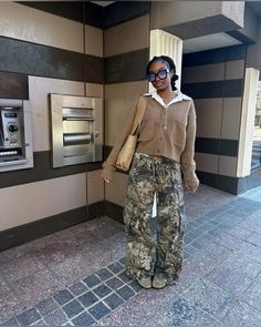 baggy pants, camo pants, camo pants outfit, outfits, streetwear, streetwear style, baggy, baggy outfits idea creds: @iconikki8 Camo Pants Leather Jacket Outfit, Leaf Camo Pants Outfit, Tree Camo Outfits, Camoflauge Outfits Aesthetic, Camp Pants Outfit Black Woman, Camo Pant Outfits, Camo Pants Aesthetic, Camo Pants Outfit Black Women, Camo Pants Outfit Winter