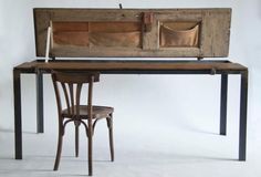 an old wooden desk and chair with two compartments on the top, sitting in front of a white background