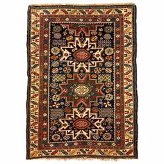 an antique persian rug with various colors and designs on the border, including red, blue,