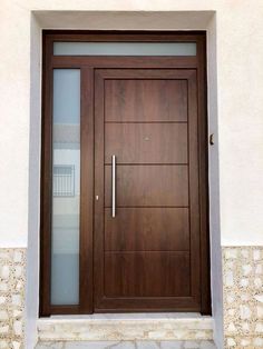 a wooden door with glass on the outside