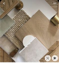 an aerial view of a living room with wood flooring and white walls, including beige rugs