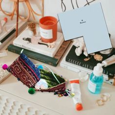 a table topped with lots of different types of cosmetics and personal care items on top of it