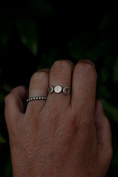 This triple goddess moon ring is super comfortable to wear and unlike triple moon rings that don't have the sterling silver full moon backing, it won't get caught on things. I have very active hands so I wanted to create a triple moon ring that could be worn easily and comfortably daily. A hand textured 7mm round raw brass full moon and two smooth crescent moons sit on top of sterling silver discs creating a moon trinity. A patina has been added to give this ring a rustic, more realistic look. P Brass And Silver Jewelry, Mystical Adjustable Moon Phase Rings, Spiritual Sterling Silver Rings With Moon Charm, Spiritual Moon Charm Promise Ring, Bohemian Moon Phase Ring, Adjustable Moon-shaped Spiritual Ring, Spiritual Crescent Moon Charm Ring, Mystical Moon Phase Ring, Bohemian Crescent Moon Phase Ring