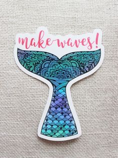 a sticker with the words make waves written in pink and blue ink on it