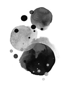 three black and white circles are in the air, with dots coming out of them