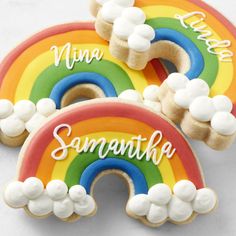 three decorated cookies with rainbows and the words mina, sannaha, and cloud