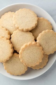 small cookies in a white bowl on a table