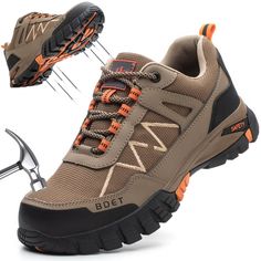 a pair of hiking shoes with spikes on the side and an orange shoelacer attached to