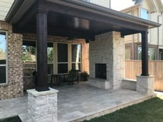 a covered patio with chairs and tables on it