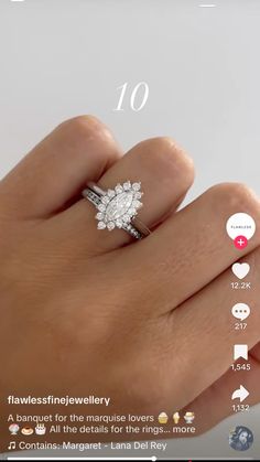 a person's hand with a diamond ring on top of it and the number ten