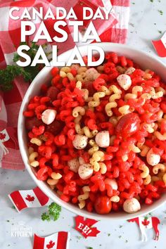 canadian pasta salad in a bowl with the title canada day pasta salad