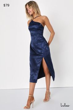 Arrive like a vision and leave everyone stunned in the Lulus Desirable Dream Navy Blue Satin Jacquard Halter Neck Midi Dress! Sleek woven satin jacquard (embossed with a pretty floral design) creates a modified, asymmetrical halter neckline and a princess-seamed bodice, supported by adjustable spaghetti straps. High, fitted waist sits atop a figure-skimming midi skirt with a sexy side slit. Hidden back zipper/clasp. Fit: This garment fits true to size. Length: Mid-calf length. Size medium measures 46.5" from top to bottom. Bust: Great for any cup size. Waist: Fitted - very fitted at natural waist. Hip: Loosely Fitted. Undergarments: May be worn with an adhesive bra, petals, or no bra. Fabric: Fabric has no stretch. Lined. Shell: 100% Polyester. Lining: 95% Polyester, 5% Spandex. Hand Wash Navy Blue Satin Dress, Halter Neck Midi Dress, Blue Halter Dress, Winter Wedding Guest Dress, Navy Blue Midi Dress, Fall Wedding Guest Dress, Blue Cocktail Dress, Ladies Clothing