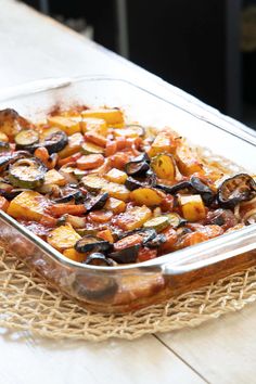 a glass casserole dish filled with cooked vegetables