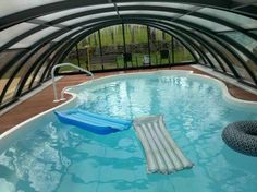 an inflatable swimming pool is shown with a slide