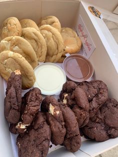 a box filled with chocolate cookies and other treats