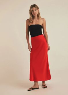 For special occasions. Any occasion, actually. The bias-cut Favorite Skirt in Pomodoro has a high, pull-on waist and a billowy fit that hugs in all the right places. Cut from a silky-soft polyester satin fabric made in Korea, it's super easy to style up or down. (It looks especially sweet with The Colette Top or The Do Silk Long Skirt With Bias Cut, Silk Bias-cut Skirt, Silk Skirt With Bias Cut And Relaxed Fit, Long Silk Bias Cut Skirt, Silk Bias Cut Long Skirt, Silk Bias Cut Flared Skirt, Fitted Bias Cut Skirt, Chic Red Silk Bottoms, Silk Asymmetrical Skirt For Night Out