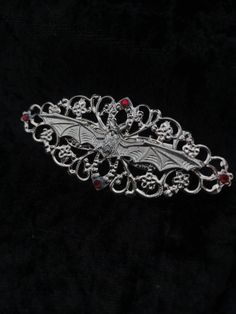 Vampire hairslide/comb Beautiful simple Filigree hair accessory with central bat design and added rhinestones.  Perfect addition to our Vampyre series. Rhinestone colour can be changed on request. The image shows the red stones. Choose between slide or comb design.  Handmade to order, Ready in 3-5 days. May take longer during busy times. Marceline Cosplay, Vampire Hair, Alt Accessories, Comb Design, Goth Fits, Goth Outfit Ideas, Victorian Gothic Style, Antler Earrings, Bat Design