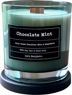 a candle that is sitting in front of a white background with the words chocolate mint on it