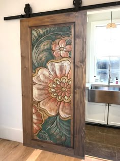 an open door with flowers painted on it