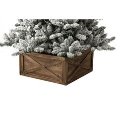 a wooden planter filled with snow covered pine trees on top of a white background