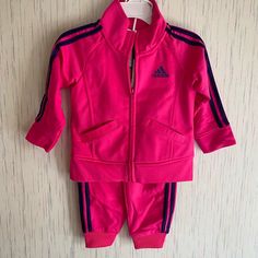 She Can't Go Wrong With This Classic Adidas Track Suit. Deciding What To Wear Just Got Easier When She's Got This Girl's Outfit To Mix And Match. Both Pieces Feature The Signature Sheen Of Tricot For Og Style. Jacket- Slanted Pockets Keep Hands Warm Set Includes- 1 Jacket And 1 Jogger Pants Pants- Elastic Waist And Cuffs For A Snug Feel Jacket- Full-Zip With Mock Neck. Nwt Adidas Sports Set With Long Sleeve, Pink Hooded Sets For Fall, Adidas Long Sleeve Playwear Sets, Pink Adidas Cotton Set, Adidas Pink Cotton Sets, Adidas Pink Long Sleeve Sets, Pink Cotton Adidas Sets, Pink Winter Sports Sets, Adidas Cotton Sets For Winter