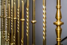 a close up view of some gold metal railings