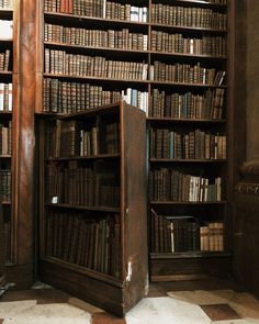 an old bookcase with many books in it