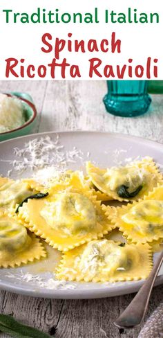 a white plate topped with ravioli covered in spinach and cheese next to a bowl of rice