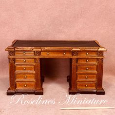 an antique wooden desk with drawers on it