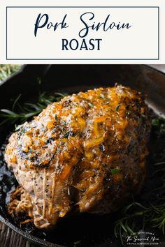 pork sirloin roast in a cast iron skillet with rosemary garnish