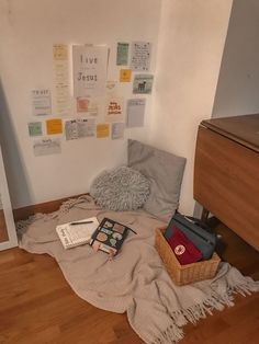 a bedroom with a bed, dresser and other items on the floor next to it