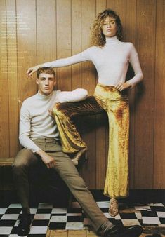 a man and woman posing for a magazine