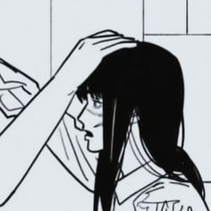 a black and white drawing of a woman brushing her hair