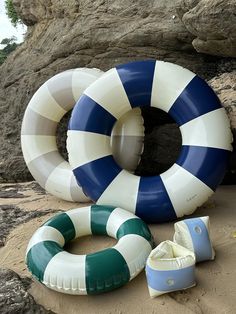 two inflatables and an inflatable life preserver on the beach