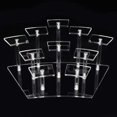 clear acrylic display cases with white buttons on the front and back sides, each holding different sized items