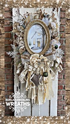 a wreath hanging on the side of a brick wall with snowflakes around it