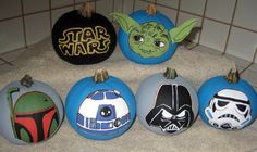 star wars painted pumpkins are sitting on the counter