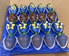 chocolate covered strawberries are arranged in the shape of stars and shells with decorations on them