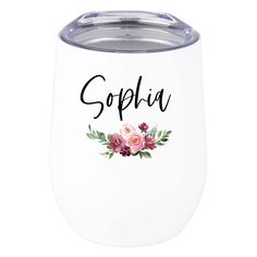 a white wine tumbler with pink flowers and the word sophia on it