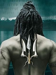 the back of a man with dreadlocks and two swords on his shoulder, facing water