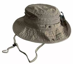 The Jungle Boonie Hat is the perfect choice for any outdoor activity. Not only does it offer protection against UV (UPF 50+) and water, it also provides excellent ventilation and moisture management with its mesh ventilation panel and moisture wicking sweatband. The branch loops and snap-up brim keeps the hat on your head comfortably no matter where you are. Made with 100% nylon. 100% Nylon UV Protection (ups 50+) Water Repellent Moisture Wicking Sweatband Branch Loops Snap-up Brim Mesh Ventilation Panel Adjustable Chin Cord Size: L-59cm XL-60cm 2XL-62cm Spring Sun Hat For Outdoor Activities In Khaki, Spring Khaki Sun Hat For Outdoor Activities, Khaki Sun Hat For Spring Outdoor, Khaki Outdoor Hat For Spring, Jungle Hat, Modern Packaging, Jungle Green, Repellent, Moisture Wicking