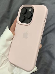 a person holding an iphone case in their hand