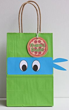 a green bag with a donut on it